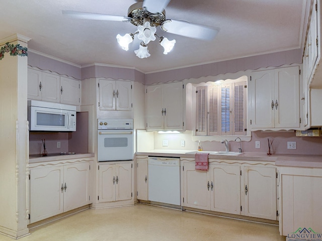 kitchen with white cabinetry, white appliances, sink, and ornamental molding