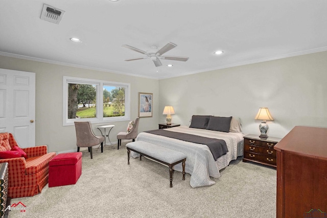 carpeted bedroom featuring ceiling fan and ornamental molding