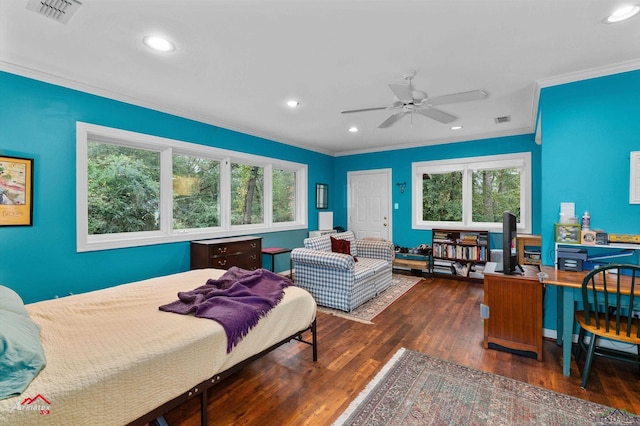 bedroom with crown molding, ceiling fan, and dark wood-type flooring