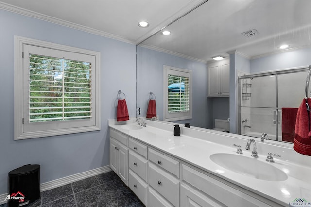 full bathroom featuring plenty of natural light, vanity, ornamental molding, and toilet