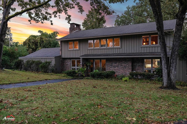 view of front of home with a lawn