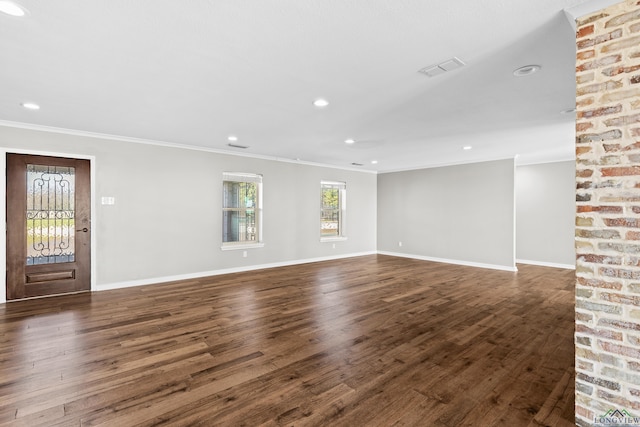 interior space featuring dark wood-type flooring and ornamental molding