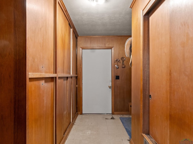 interior space with light floors and wooden walls