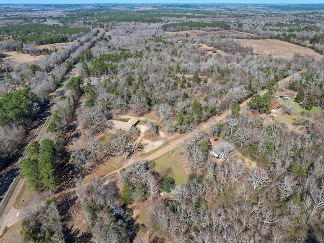 aerial view featuring a wooded view