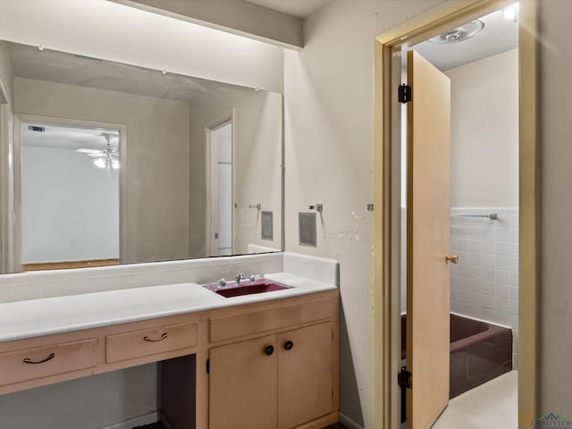 bathroom with a ceiling fan and vanity