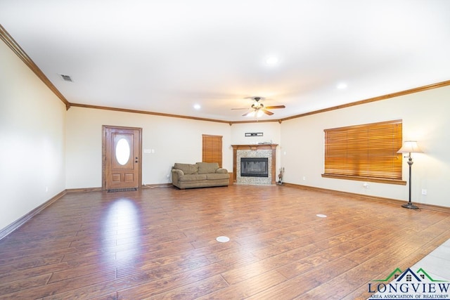 unfurnished living room with ceiling fan, hardwood / wood-style floors, and crown molding