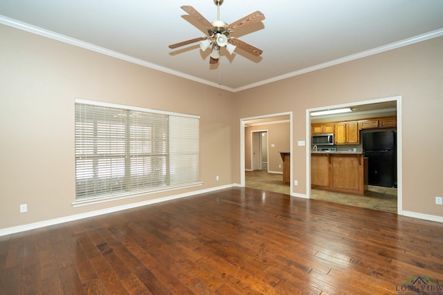 unfurnished living room with ornamental molding, baseboards, hardwood / wood-style floors, and a ceiling fan