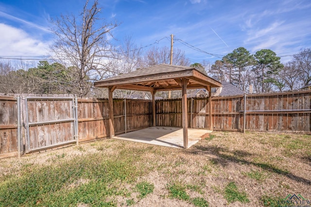 view of yard featuring a gazebo, a patio, and fence