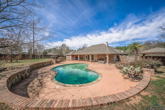 view of pool featuring a patio area, a fenced backyard, and a fenced in pool