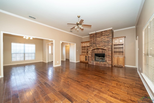 unfurnished living room with visible vents, baseboards, dark wood-style floors, ceiling fan, and a brick fireplace