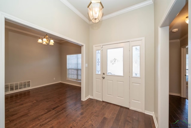 foyer featuring dark wood-style flooring, visible vents, crown molding, and baseboards