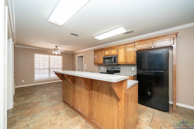 kitchen featuring visible vents, appliances with stainless steel finishes, light countertops, and stone tile flooring