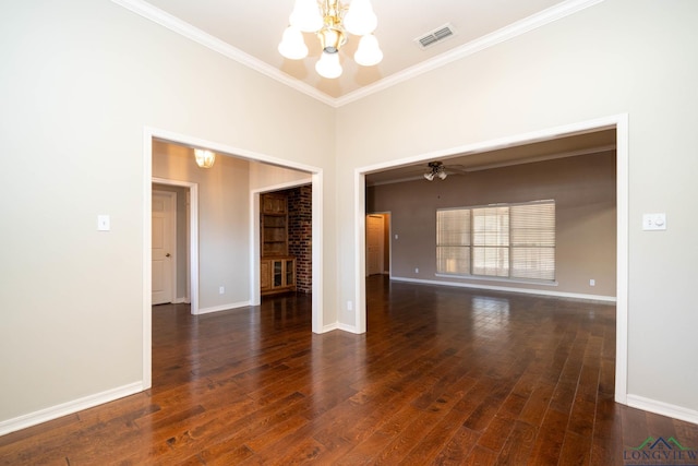 unfurnished room featuring ornamental molding, hardwood / wood-style flooring, visible vents, and baseboards