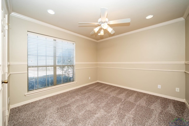 spare room with carpet floors, ornamental molding, and a ceiling fan