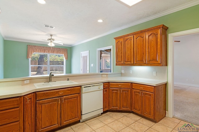 kitchen featuring white dishwasher, sink, ceiling fan, ornamental molding, and light colored carpet