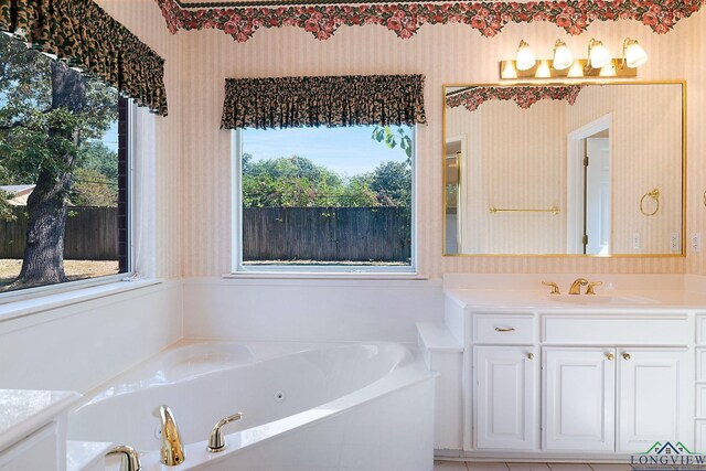 bathroom with a bathing tub and vanity