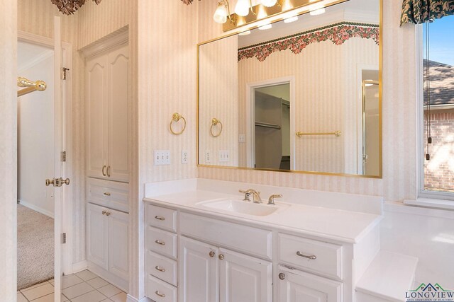 bathroom with tile patterned floors and vanity