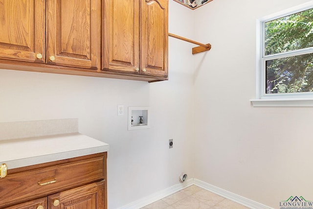 laundry room with electric dryer hookup, cabinets, and washer hookup