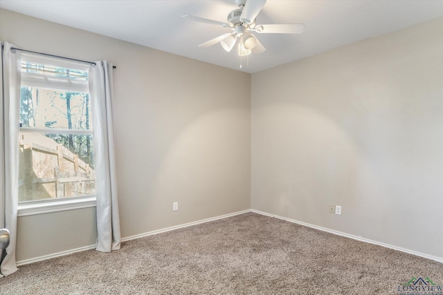 unfurnished room featuring light carpet and ceiling fan