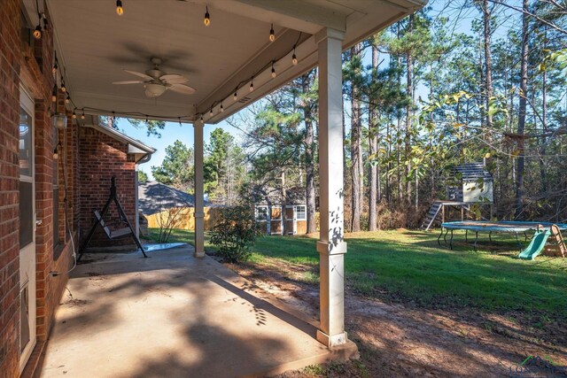 view of patio / terrace with ceiling fan and a trampoline