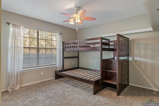 unfurnished bedroom with carpet flooring and ceiling fan