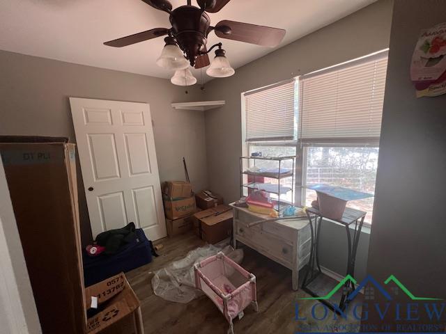 bedroom with wood finished floors and ceiling fan