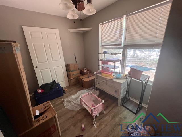 bedroom with wood finished floors
