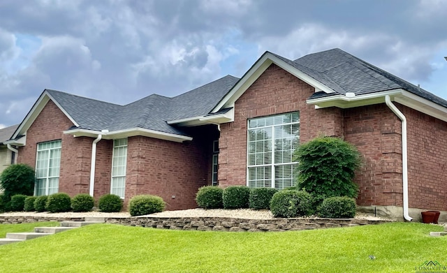 view of home's exterior featuring a lawn