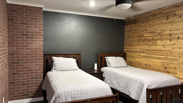bedroom with wooden walls, ornamental molding, and ceiling fan