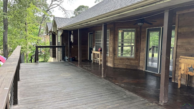 wooden terrace featuring ceiling fan