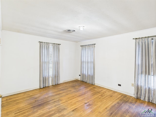 411 W Harrison St, Jefferson, TX 75657 - unfurnished room featuring wood finished floors and baseboards