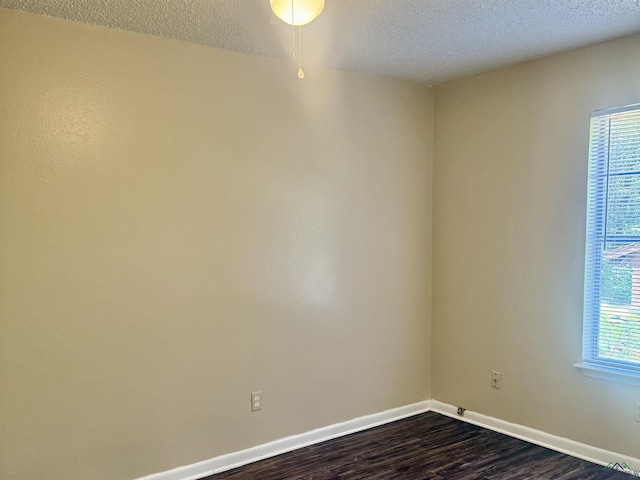 3023A Bernice, Longview, TX 75605 - spare room featuring dark wood-style floors and a textured ceiling