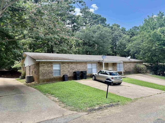 3023A Bernice, Longview, TX 75605 - view of front facade with brick siding, a front yard, and driveway