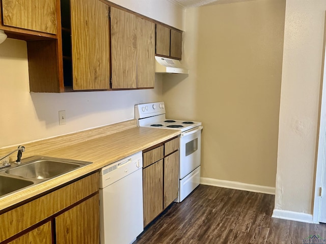 3023A Bernice, Longview, TX 75605 - kitchen with white appliances, under cabinet range hood, light countertops, and dark wood finished floors