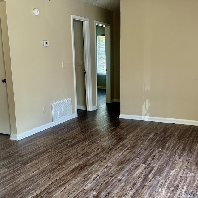 3023A Bernice, Longview, TX 75605 - empty room with dark wood-type flooring and baseboards