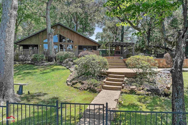 exterior space with a yard, a pergola, fence, and stairs