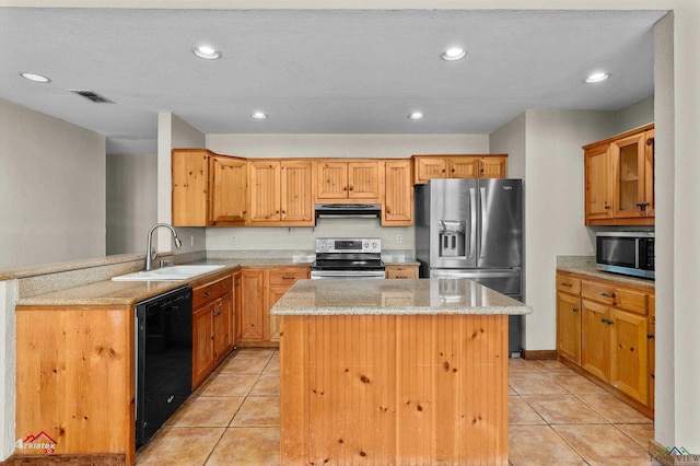 kitchen with a sink, a peninsula, stainless steel appliances, under cabinet range hood, and a kitchen island