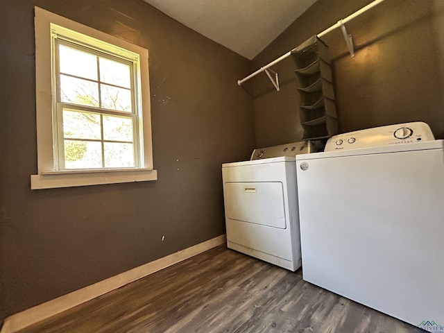 washroom with washer and clothes dryer and dark hardwood / wood-style floors