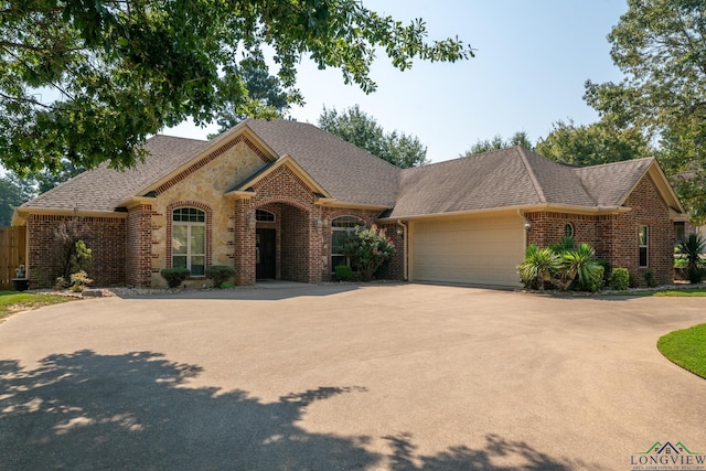 single story home featuring a garage