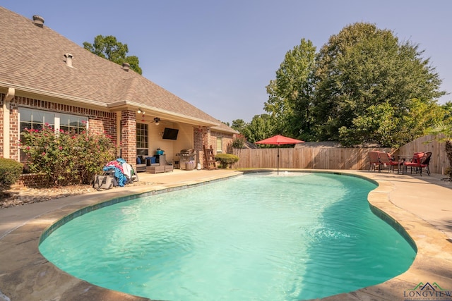 view of pool featuring ceiling fan and a patio