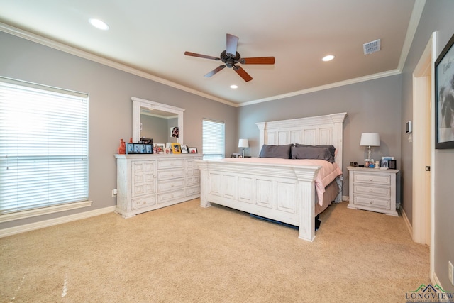 bedroom featuring ceiling fan, light colored carpet, and ornamental molding