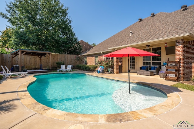 view of swimming pool with a gazebo, an outdoor hangout area, ceiling fan, and a patio area