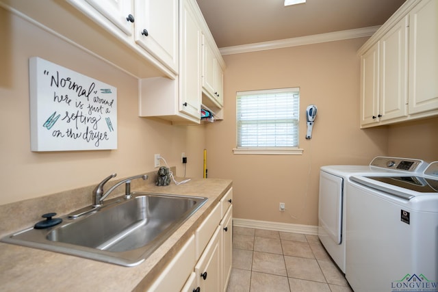 laundry room featuring sink, cabinets, light tile patterned flooring, washer and dryer, and ornamental molding