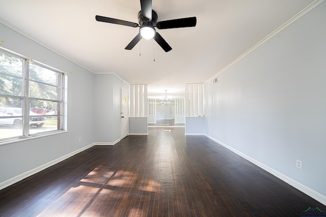 unfurnished living room with ceiling fan with notable chandelier, crown molding, and dark wood-type flooring