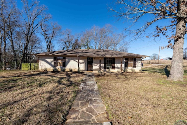 single story home with a front yard