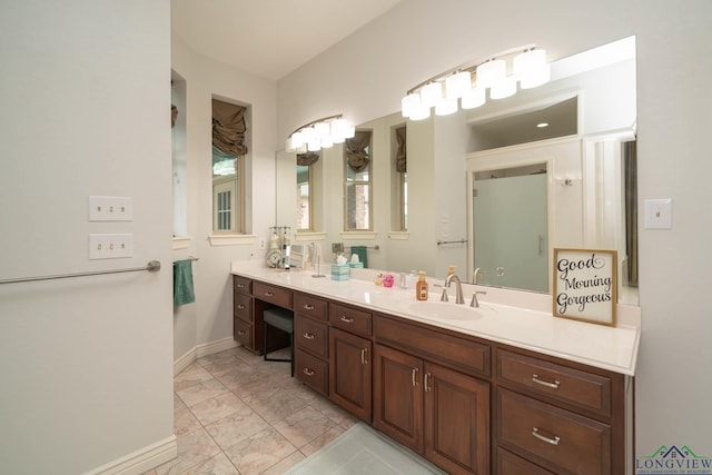 335 Winding Way, Hallsville, TX 75650 - bathroom with marble finish flooring, vanity, and baseboards