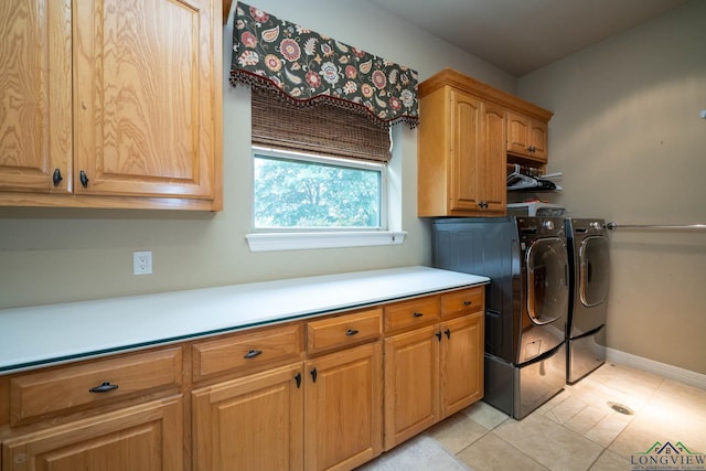335 Winding Way, Hallsville, TX 75650 - washroom featuring cabinet space, separate washer and dryer, baseboards, and light tile patterned floors