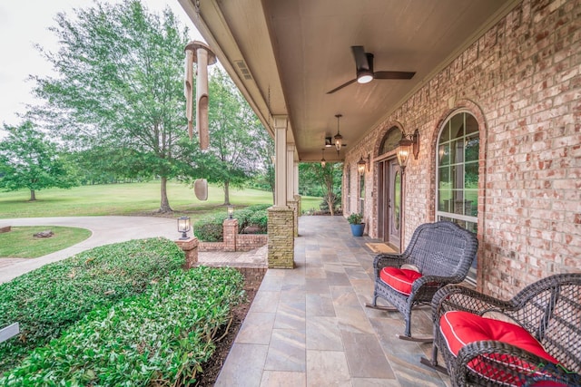 335 Winding Way, Hallsville, TX 75650 - covered porch with a yard and ceiling fan