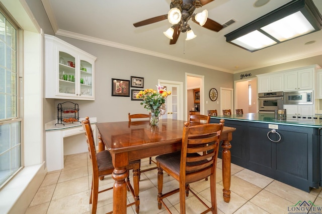 335 Winding Way, Hallsville, TX 75650 - dining room with ornamental molding, a ceiling fan, and light tile patterned flooring