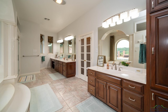 335 Winding Way, Hallsville, TX 75650 - full bath featuring two vanities and french doors